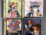 a group of four anime cds sitting on top of a table