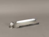 a golf ball sitting on top of a metal object