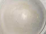 a close up of a glass bowl with a lot of water in it