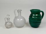 three vases that are sitting next to each other on a table