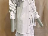 an image of a mannequin dressed in a white shirt and skirt