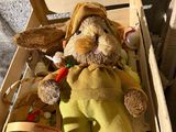 a stuffed animal in a wooden crate with other items