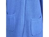 a close up of a blue cardigan sweater with pockets