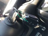 a close up of a car dashboard with a cell phone attached to it