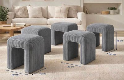 three stools and a table in a living room with a couch and a coffee table