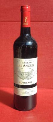 a bottle of wine that is sitting on a table