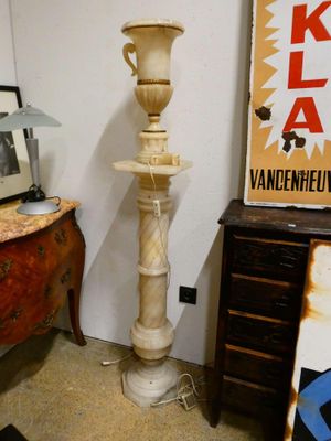 a lamp that is sitting on a table in a room
