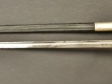 pair of silver and gold - plated swords from the late 19th century