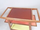 a wooden table with a glass top on a white background