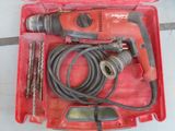 a red box with tools in it on a table