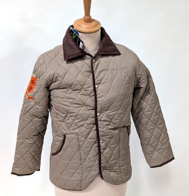 a jacket on a mannequin stand with a tie on it