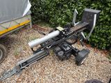 a machine that is sitting in the gravel