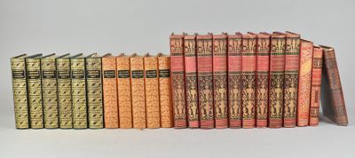 the books are lined up in a row on the table