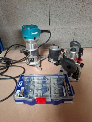 a small router that is sitting on a table next to a tool box