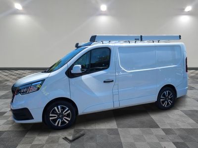 the white van is parked on a checkered tile floor