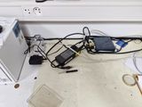 a lot of wires that are on the floor in the kitchen