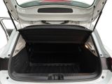 a trunk of a white car with its doors open