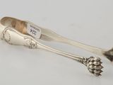 a pair of silverware spoons with flowers and leaves
