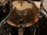 a close up view of a drum set up on the floor