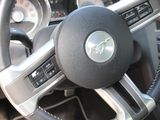 a close up of a steering wheel and dashboard of a car