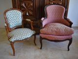two chairs sitting next to each other in a room