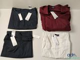 trois paires de chemises et de pantalons de ville pour homme posées sur une table