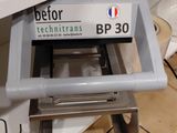 a machine that is sitting on a counter in a kitchen