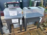 two plastic bins sitting on top of a pallet