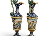 pair of blue and gold vases with images of animals on them