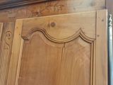 a close up of a wooden door with a metal handle