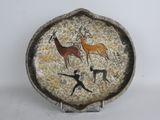 a picture of a plate with a painting of animals on it