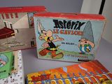 three boxes of cartoon toys are sitting on a table next to each other