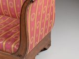 an image of a pink and gold striped chair on a white surface