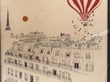 painting of a hot air balloon flying over a city with a red, white and blue balloon in the sky