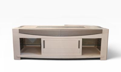 an image of a white tv stand with a glass door and drawers