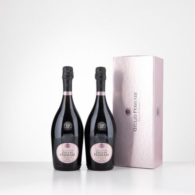 two bottles of wine sitting next to each other on a table