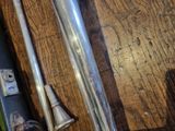 a close up of a baseball bat on a wooden table