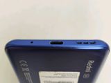 the back of a cell phone with a blue back and a white back