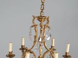 a chandelier that is hanging from the ceiling