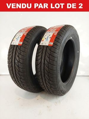 a pair of tires on a white surface with a red label