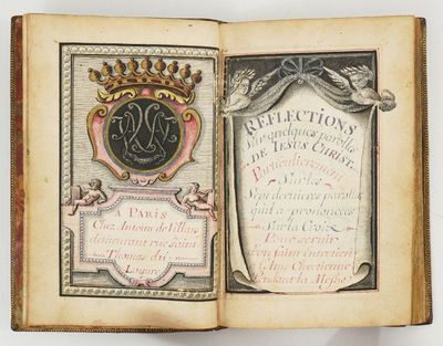un livre ouvert sur lequel est représentée une couronne