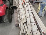 a pile of wood sitting on the floor next to a lawn mower