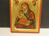 an icon of the virgin mary and child jesus on a gold background