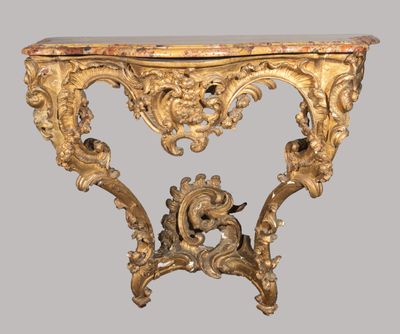 an antique console table with a marble top and gold leaf decoration