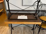 two chairs and a table with a book on it
