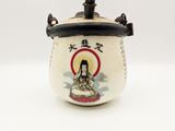 a white vase with a picture of a woman on it