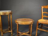 two chairs and a table are shown against a gray background