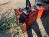 a small machine that is sitting on the side of the road