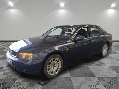 a picture of a blue car parked in a garage