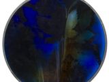 an image of a blue and black glass plate on a white surface